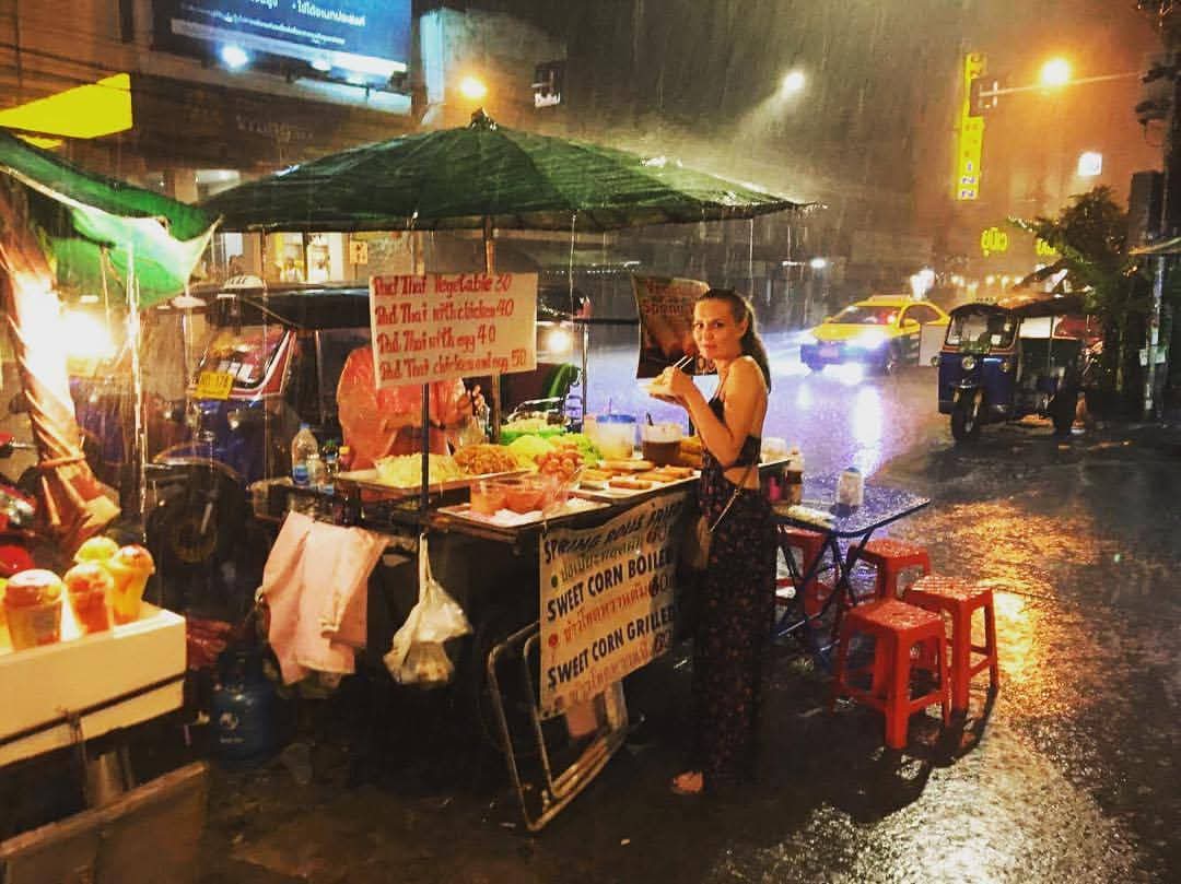 Karolina Schinkel at a street food stall in the rain